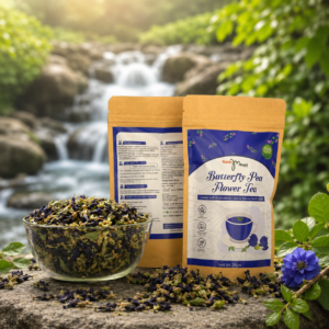 Kadambari Butterfly Pea Flower Tea packaging with dried butterfly pea flowers displayed near a natural waterfall background.