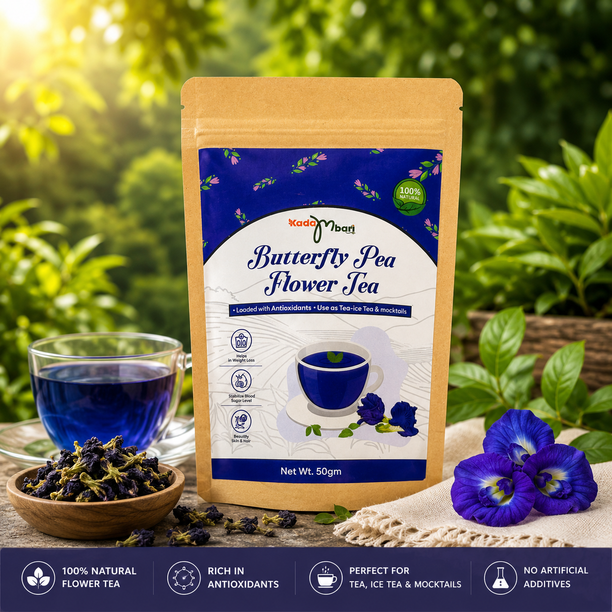 Kadambari Butterfly Pea Flower Tea 50gm pack with brewed blue tea and dried butterfly pea flowers in a natural garden setting.