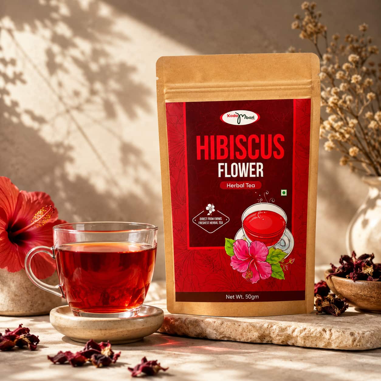 Kadambari Hibiscus Flower Tea pouch with a cup of hibiscus tea